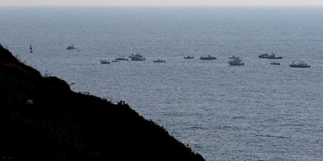 Lebanese protesters sail in boats with slogans affirming Lebanon's right to its offshore gas wealth near a border-marking buoy between Israel and Lebanon in the Mediterranean waters off the southern town of Naqoura Sept. 4, 2022.