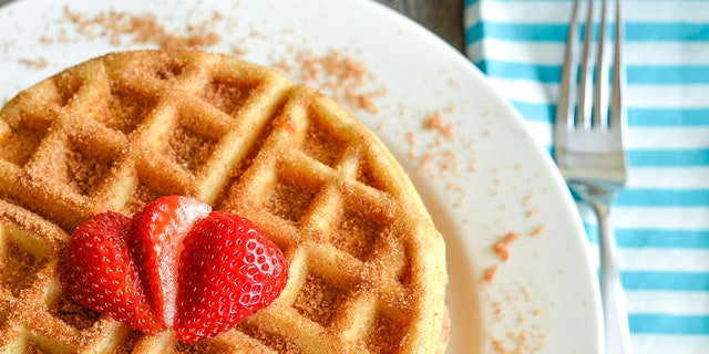 Churros waffles can be serves with strawberries, or any fruit you desire.