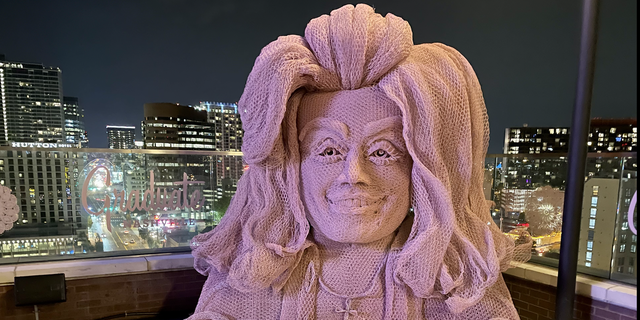 White Limozeen is a new Dolly Parton-themed rooftop bar at The Graduate hotel in Nashville. The decor includes a 10-foot-tall bust of Parton crafted from chicken wire by Tennessee artist Ricky Pittman.