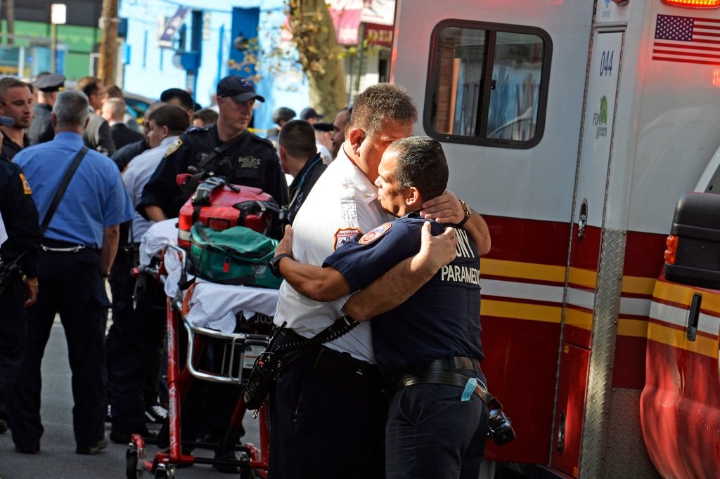 The NYPD respond to 40-19 20th ave., Queens, where a man barricaded himself inside after stabbing an EMS LT who died upon arrival at the hospital.