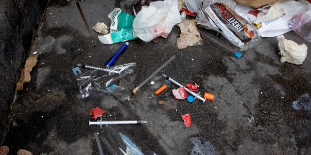 Used needles are seen on the street during a city sweep of a homeless encampment, September 22, 2022 in New York City, New York