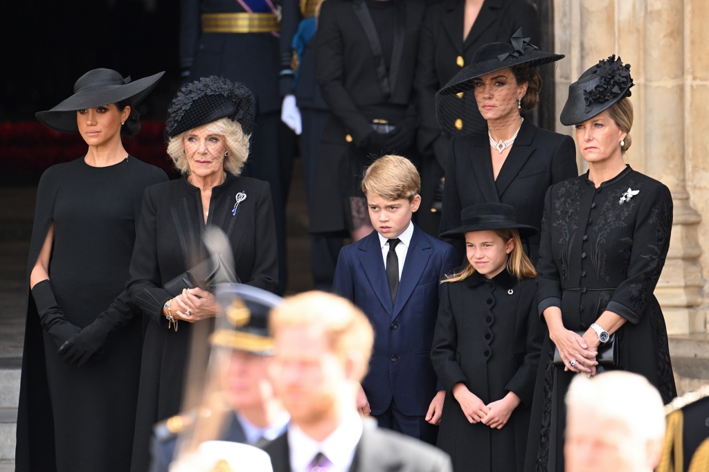 Meghan, Duchess of Sussex, Camilla, Queen Consort, Prince George of Wales, Catherine, Princess of Wales, Princess Charlotte of Wales and Sophie, Countess of Wessex during the State Funeral of Queen Elizabeth II