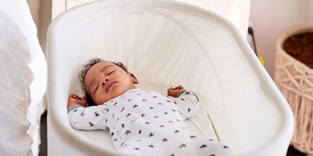 Babies should always sleep on their backs and in an empty crib or bassinet to avoid obstruction of breathing.