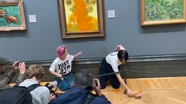 Just Stop Oil activists have thrown tomato soup over Vincent Van Gogh's masterpiece 'Sunflower' at the National Gallery in London.
Climate activists glued themselves to the priceless painting in the latest demonstration after a string of eco-warrior stunts this week. After throwing soup on the painting - which has a glass cover - one of the protestors yelled: 'What is worth more, art or life?