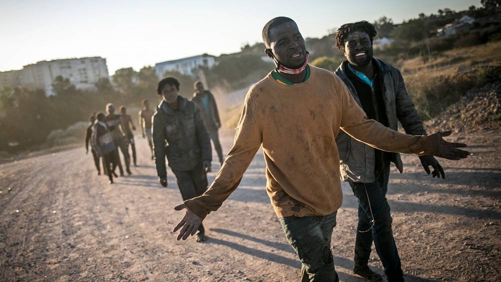 Migrants building life in Spain face ’emotional toll’ after deadly journey, says author Ousman Umar