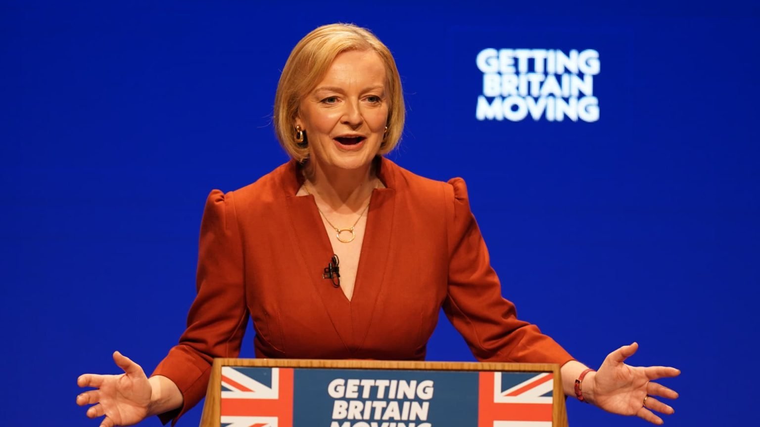 UK’s Liz Truss pledges tax-cutting future in landmark speech plagued by protest and political infighting