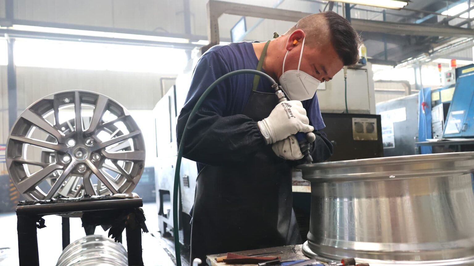 China’s factory activity drops, bogged down by more Covid controls
