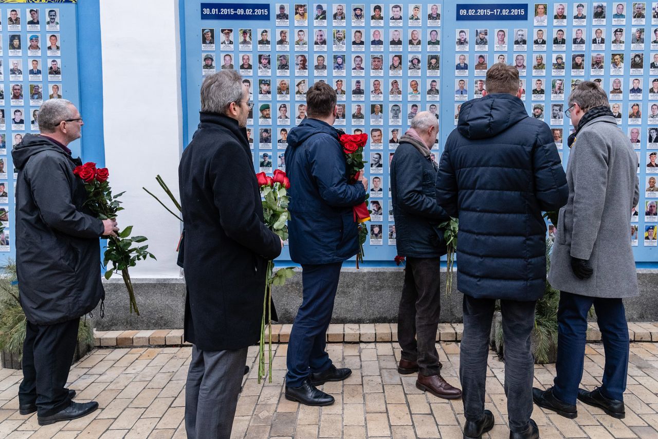 Ambassadors of European countries lay roses at the Wall of Remembrance in Kyiv on February 16. The wall contains the names and photographs of military members who have died since the conflict with Russian-backed separatists began in 2014.