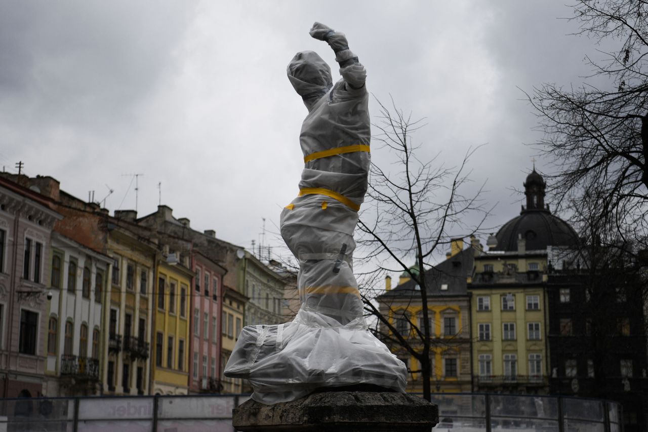 A statue is covered in Lviv on March 5. <a href=
