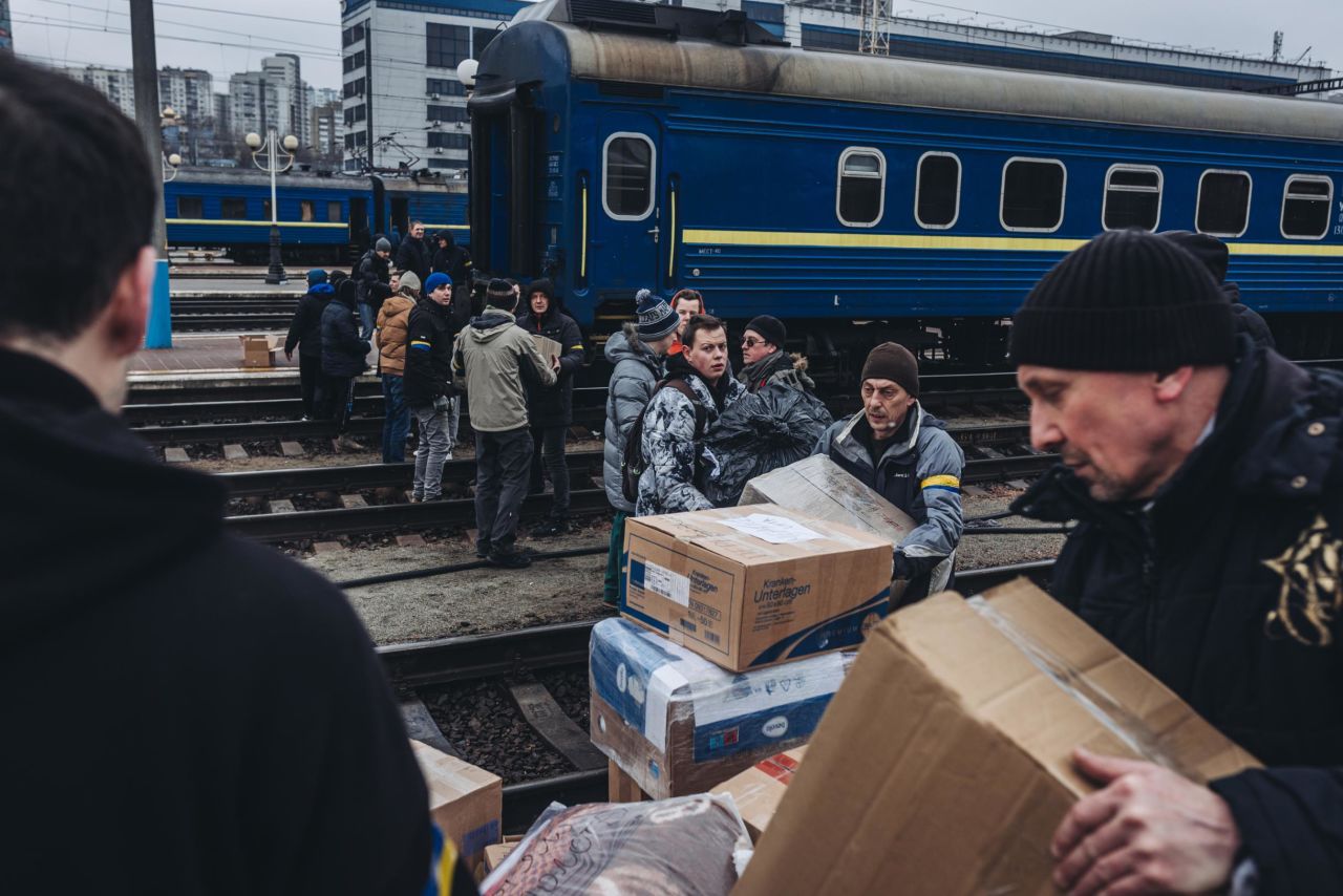 People form a human chain to transfer supplies into Kyiv on March 3.