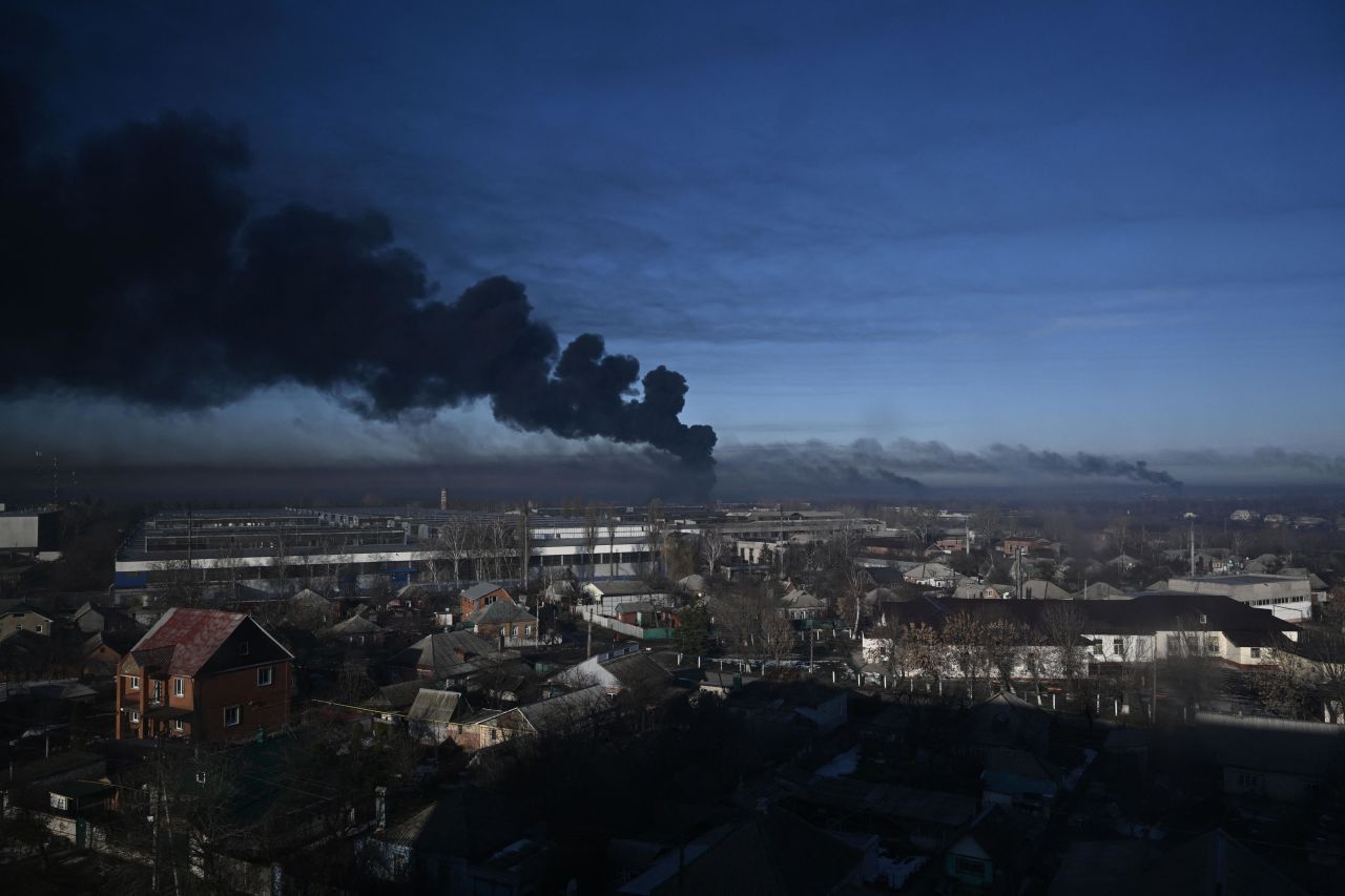 Smoke rises from a military airport in Chuhuiv on February 24. <a href=