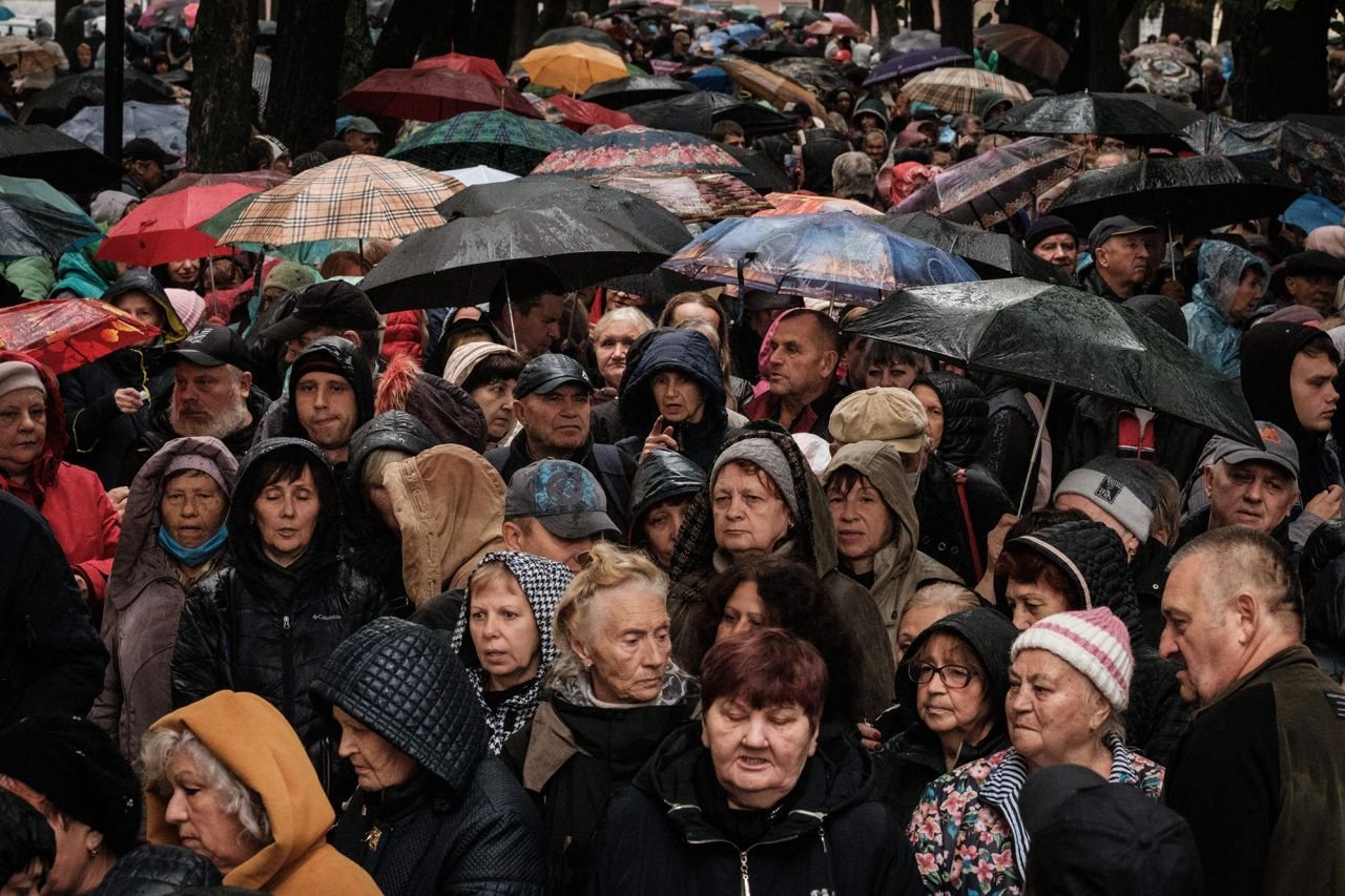 People wait for food aid distributed by the local branch of Caritas Internationalis, a Catholic charity organisation, in Kharkiv, Ukraine, on September 27.