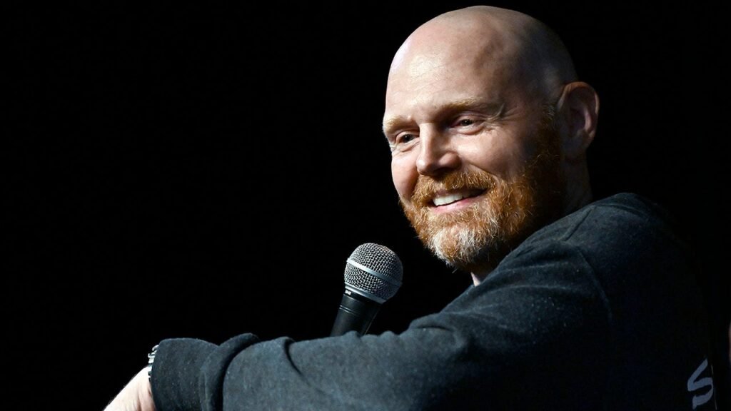 Bill Burr hilariously ribs Mannings in simulcast appearance, begs cameras to stop showing ‘sad’ Mac Jones