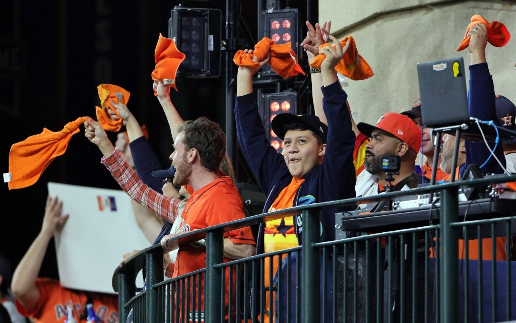 Astros fans cheer during the eighth inning of their team's win over the Phillies.