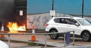 Horror moment man hurls petrol bomb at migrant centre ‘before killing himself’