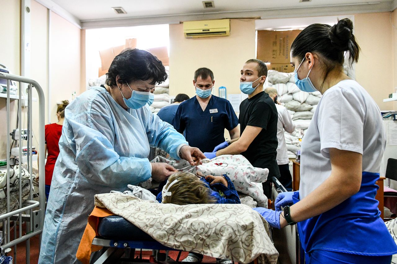Staff members attend to a child at a children's hospital in Zaporizhzhia on March 18.