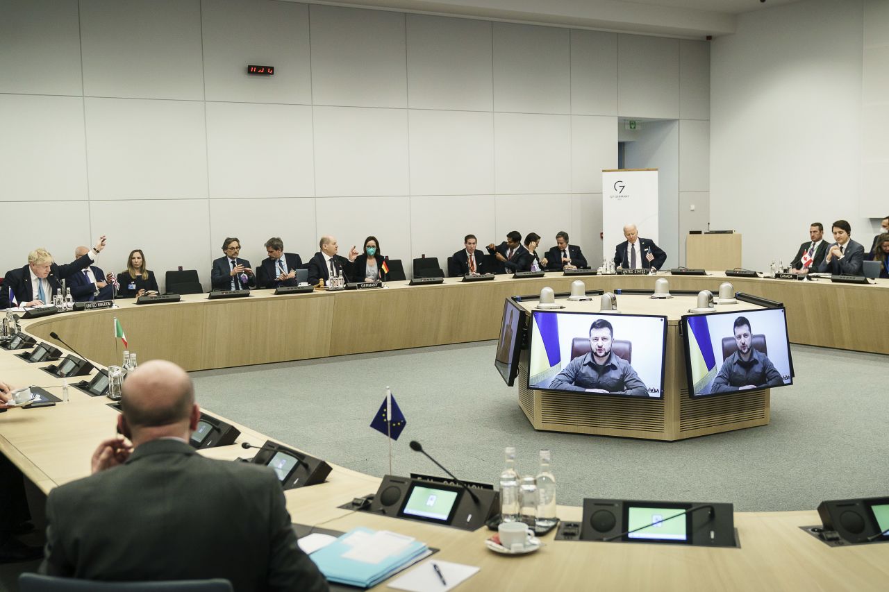 Ukrainian President Volodymyr Zelensky addresses world leaders via video at the NATO summit in Brussels, Belgium, on March 24. Zelensky stopped short of issuing his usual request for a no-fly zone, but he did say Ukraine needs fighter jets, tanks and better air defenses.