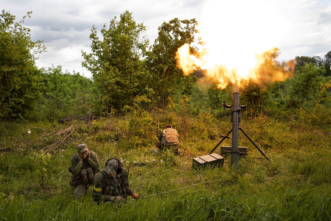 Ukrainian servicemen fire mortars toward Russian positions in the east Kharkiv region of Ukraine on May 17.