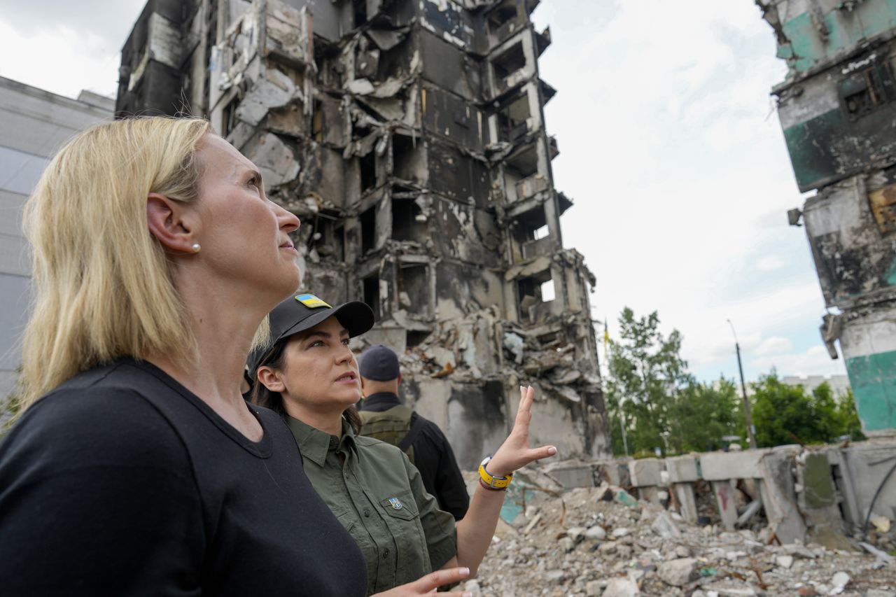 U.S. ambassador to Ukraine Bridget Brink, left, listens to Ukraine's Prosecutor General Iryna Venediktov during a tour of Borodyanka, Ukraine, on June 4.
