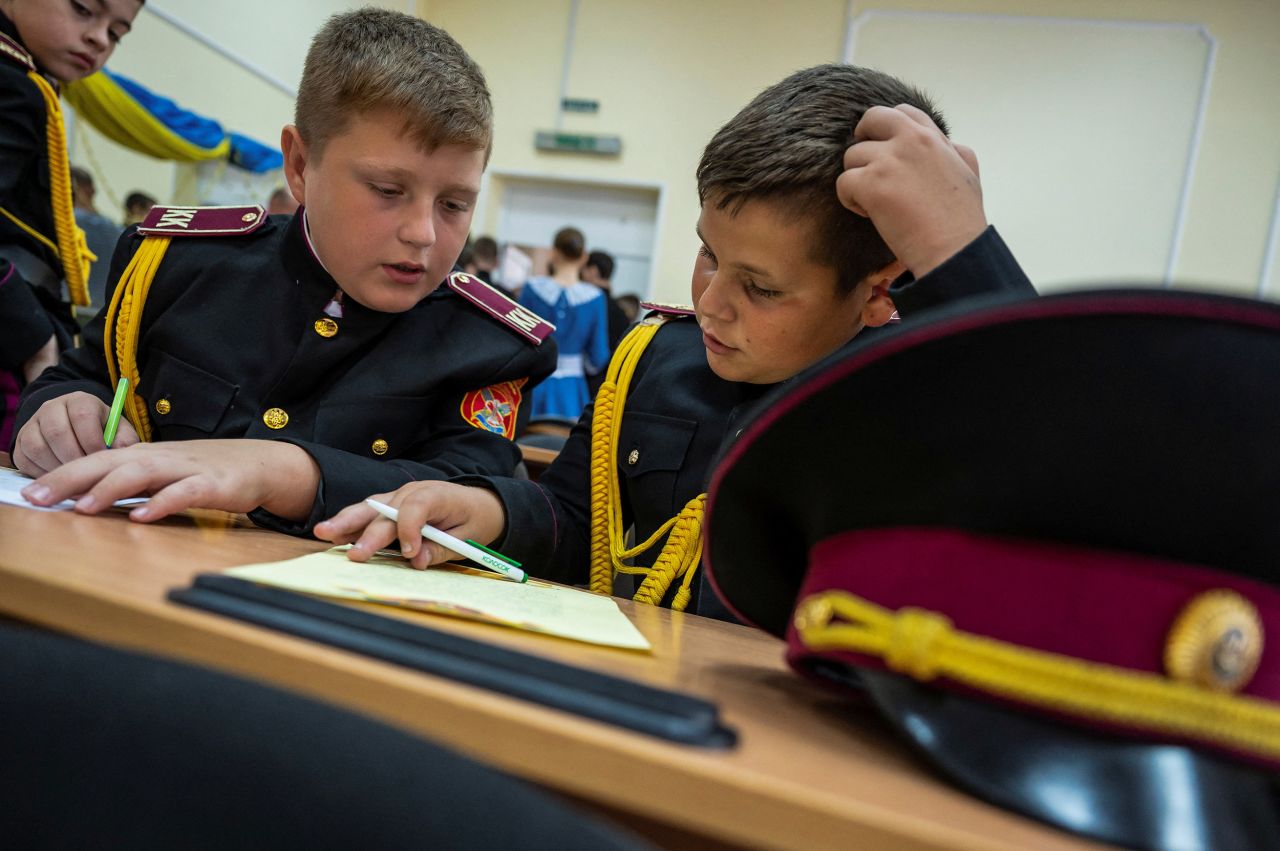 Students at a military school write letters to Ukrainian servicemen during a lesson in Kyiv, Ukraine, on July 27.