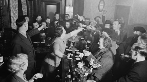 Patrons of The Crown pub, on Blackfriars Road, London, celebrate the wedding of then-Princess Elizabeth and Philip Mountbatten, Duke of Edinburgh, in November 1947.