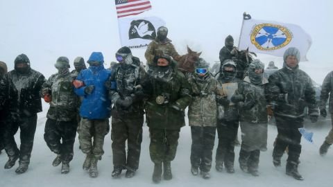 Military veterans march through blizzard conditions to support