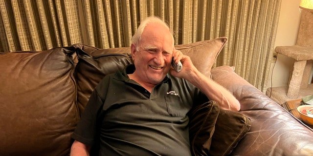 John F. Clauser speaks to reporters on the phone at his home in Walnut Creek, Calif., on Tuesday, Oct. 4, 2022.