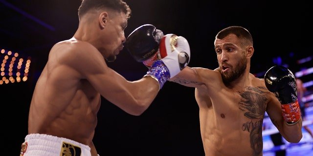 Vasiliy Lomachenko, right, punches Jamaine Ortiz during a lightweight boxing match Saturday, Oct. 29, 2022, in New York.