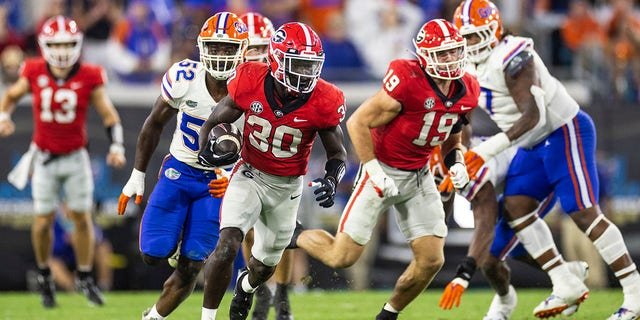 Daijun Edwards of the Georgia Bulldogs runs the ball against the Florida Gators at TIAA Bank Field on Oct. 29, 2022, in Jacksonville.
