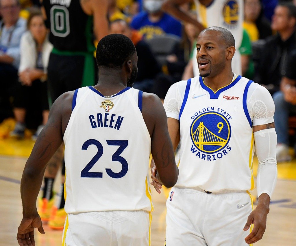 Golden State Warriors' Draymond Green #23 high fives Andre Iguodala #9 during Game Five of the 2022 NBA Finals on June 13, 2022 at Chase Center in San Francisco, California.