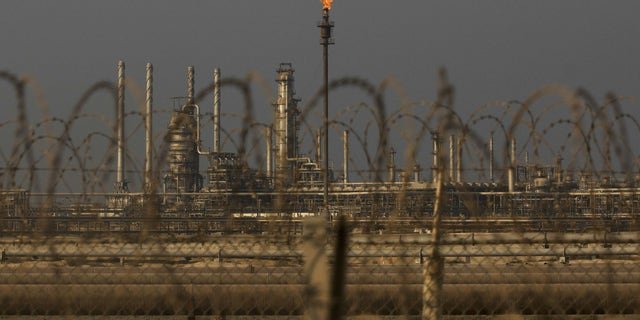 A flame burns off waste gas at Saudi Aramco's Ras Tanura oil refinery and terminal in Ras Tanura, Saudi Arabia. Senate Foreign Relations Committee Chairman Sen. Bob Menendez is urging the Biden Administration to cease cooperation with Saudi Arabia after OPEC moved to cut oil production.