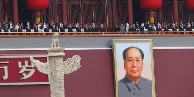 Chinese President Xi Jinping (C), standing with former President Hu Jintao, attends the celebration marking the 100th anniversary of the founding of the Chinese Communist Party on July 1, 2021 in Beijing.