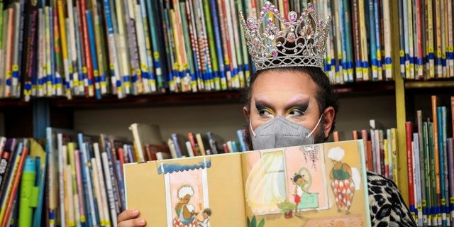 Drag queen Just JP reads stories to children during a Drag Story Hour at Chelsea Public Library in Chelsea, MA on June 25, 2022.