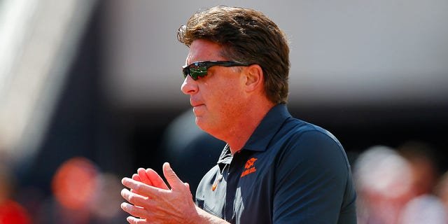 Oklahoma State Cowboys Head coach Mike Gundy cheers on his team as he walks onto the field for a game against the Texas Tech Red Raiders at Boone Pickens Stadium on Oct. 8, 2022 in Stillwater, Oklahoma.