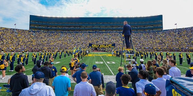 View of the Michigan Marching Band performing on the field before a game between the Michigan Wolverines and Connecticut Huskies at Michigan Stadium Sept. 17, 2022, in Ann Arbor, Mich.