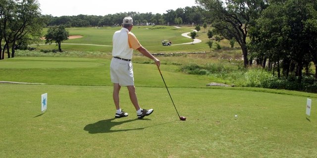 FILE PHOTO: A golfer stands in the tee box at the Avery Ranch Golf Club in Austin, Texas.