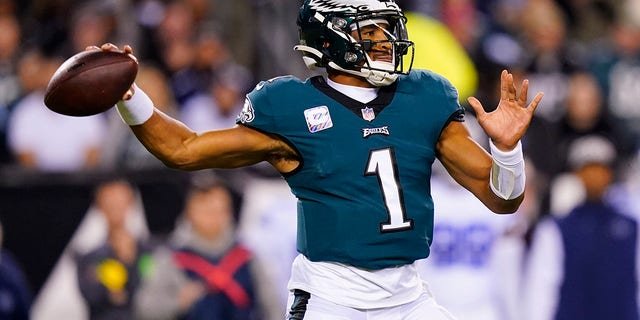 Philadelphia Eagles' Jalen Hurts looks to pass during the first half of an NFL football game against the Dallas Cowboys on Sunday, Oct. 16, 2022, in Philadelphia.