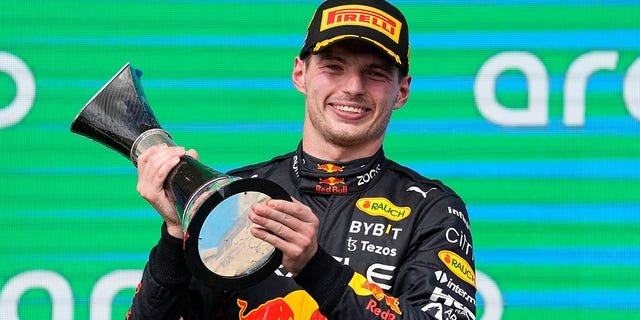 Red Bull driver Max Verstappen, of the Netherlands, raises the trophy after winning the Formula One U.S. Grand Prix auto race at Circuit of the Americas, Sunday, Oct. 23, 2022, in Austin, Texas.