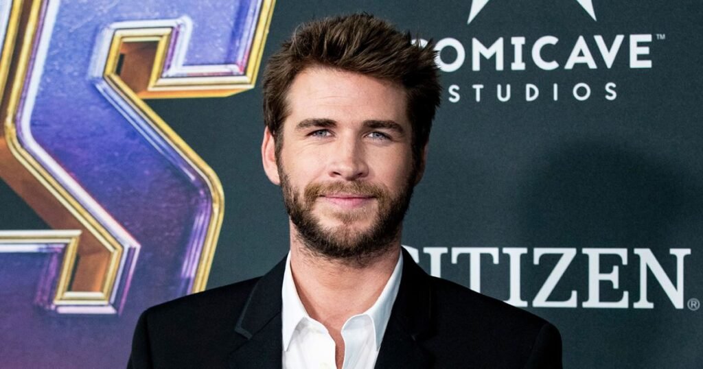 Shirtless Liam Hemsworth Cuddles — and Kisses — His Beloved Dog Dora in Adorable Photo