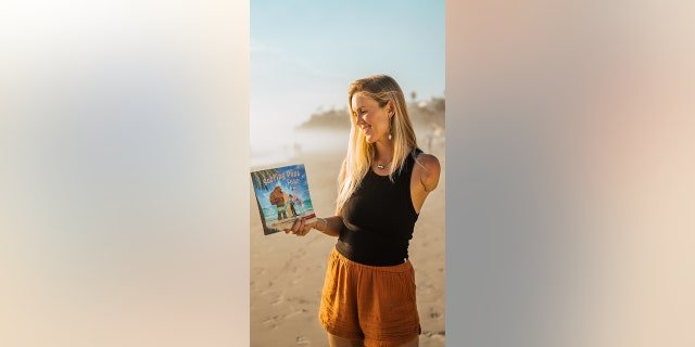 Bethany Hamilton holds a copy of "Surfing Past Fear." She would much rather help others "get back out there" rather than dwell on things that can go wrong or worry about the "worst-case ‘what ifs,’" she told Fox News Digital.