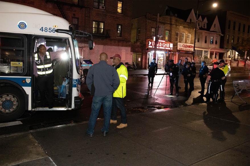 Police investigate the scene of a crash in Brooklyn involving a MTA bus