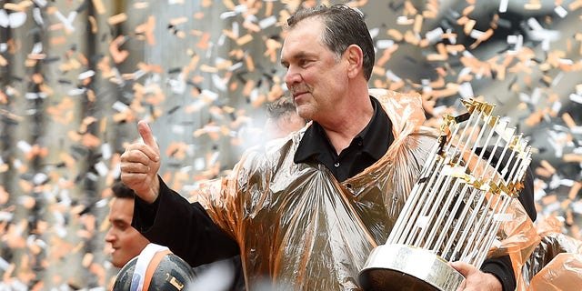 Manager Bruce Bochy of the San Francisco Giants waves to the crowd during the San Francisco Giants' World Series victory parade Oct. 31, 2014, in San Francisco, California.