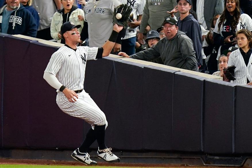 Aaron fields a ball in right field in Game 4 of the ALCS.