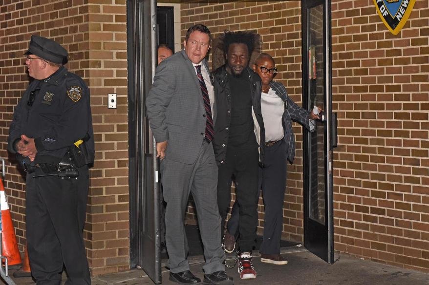 Alvin Charles walked out of the 73rd Precinct on his way to the courthouse.