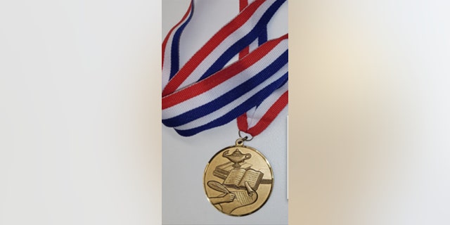 The winner of the National Handwriting Contest, hosted by Zaner-Bloser, will receive this medal.