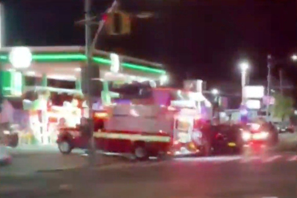 An ambulance at the scene where four cops were hurt when fleeing driver Nicholas Deosaran allegedly struck two unmarked cars.