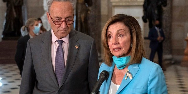 Senate Majority Leader Chuck Schumer, D-N.Y., and House Speaker Nancy Pelosi, D-Calif., were both filmed demanding that former acting Attorney General Jeffrey Rosen implore Trump to make a statement urging the rioters to stop. (AP Photo/Carolyn Kaster)