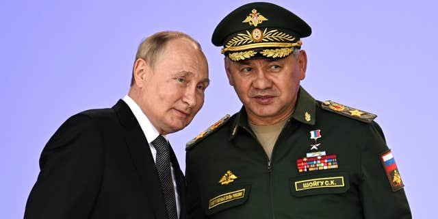 Russian President Vladimir Putin (left) vows to strengthen Russia's military cooperation with its allies at the Army 2022 International Military and Technical Forum in the Patriot Park outside Moscow, Russia, on Aug. 15, 2022.