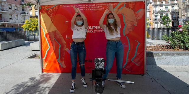 Two girls record a TikTok dance in the Plaza de Nelson Mandela on June 12, 2021, in Madrid, Spain. 