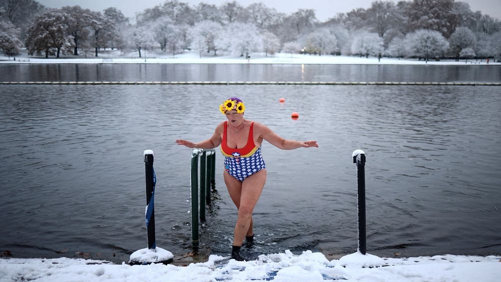 Snow disrupts travel in the UK as cold snap grips northern Europe